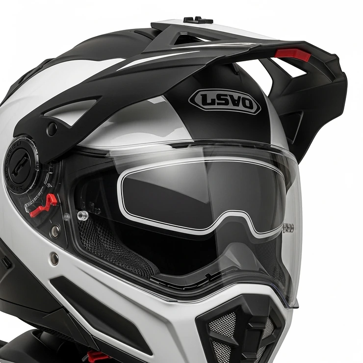 Close-up of a premium adventure motorcycle helmet with a clear visor and integrated sun shield, suitable for on and off-road riding.