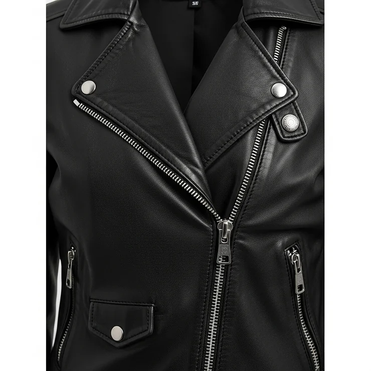 Close-up of the front of a women's black leather motorcycle jacket, showing the zipper and lapels.