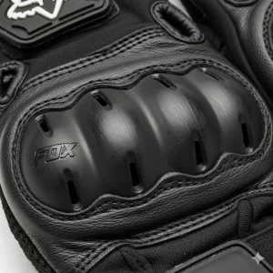 A detailed view of the knuckle protection on the Fox Bomber motorcycle gloves, featuring a hard plastic shell.