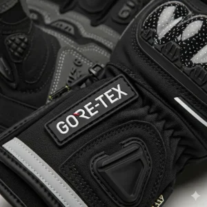 A close-up of a GORE-TEX logo on a pair of high-performance waterproof motorcycle gloves, indicating advanced waterproofing technology.