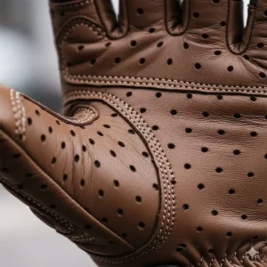 Close-up of perforated leather on the palm of a summer motorcycle glove, showing air vents for maximum airflow.