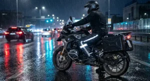 High-visibility reflective safety strips on men's motorcycle riding overpants during night rain riding.