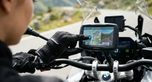 Woman using a GPS touchscreen while wearing fitted motorcycle gloves for small hands