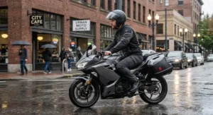 Commuter wearing waterproof motorcycle pants during a short rainy city ride