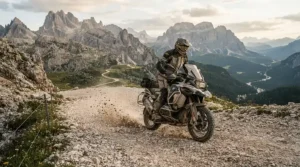 Rider navigating a rocky mountain pass in adventure touring boots vs street touring boots