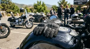 Affordable textile motorcycle gloves for hot weather displayed on a motorcycle tank
