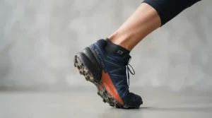Mens professional racing boots showing textured soles and ergonomic ankle support