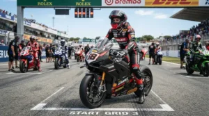 Rider wearing racing boots for short riders waiting at the starting grid before a race.
