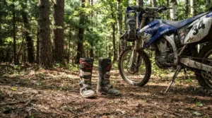 Exploring a dense pine forest path with durable adventure boots for street and dirt.
