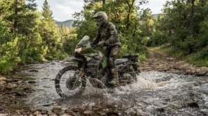 Testing waterproofing tradeoffs on budget dual sport motorcycle boots splashing through a shallow creek.