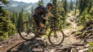 Planting a foot securely on rocks wearing sturdy enduro boots for beginner off-road riders.