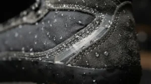 Close-up view of seam sealing on waterproof women's motorcycle boots for rain designed to block moisture.